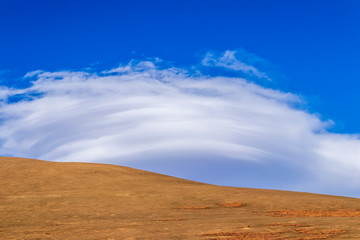 sand mountain with blue sky