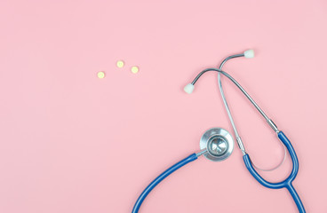 Top view with copy space of Stethoscope on the pink background, Medical and Healthy concept