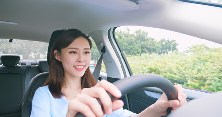 asian woman driving car