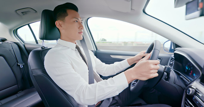 Business Asian Man Driving Car