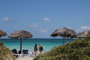 Caribbean beach with chairs and umbrellas