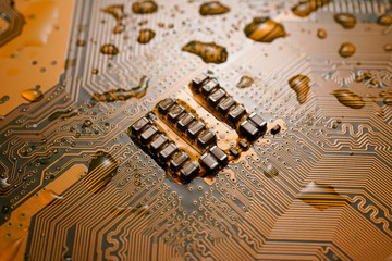 A Orange colour waterproof water resistant Printed Circuit Board with CPU, SMD & IC mounted part on...
