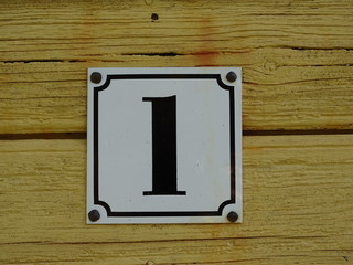 number at a wooden wall