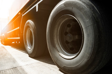 closeup a truck wheels of semi truck trailer