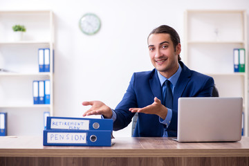 Young male accountant working in the office