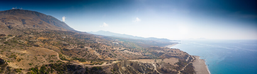 Seascape and mountain against sky