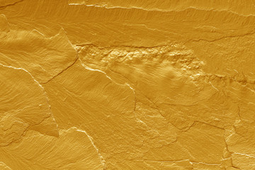 gold paint stone texture glitter abstract background.
