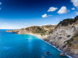 Seascape and mountain against sky
