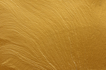 gold paint stone texture glitter abstract background.