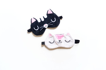 Mask of a black and white cat for sleeping on the eyes.