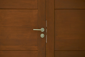 wood door and silver handle for background