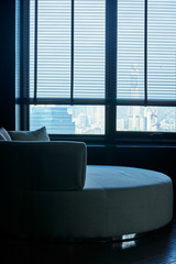 empty sofa near the window and light from outsite feel lonely