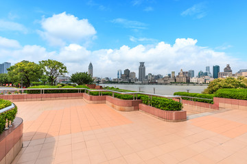Shanghai skyline and empty square floor in city park
