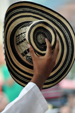 Man's Hand Holding Traditional Colombian Sombrero Vueltiao
