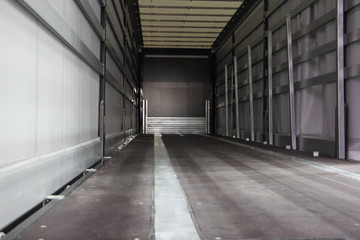New empty semi trailer interior rear view close-up, truck transportation logistics