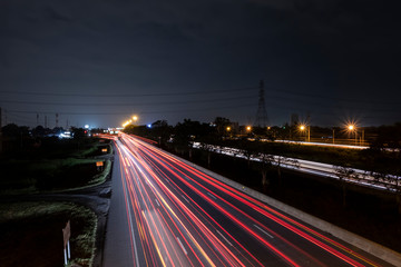 Fototapeta na wymiar Car lights on the road