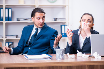 Two employees suffering at workplace