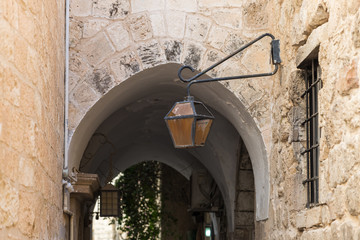 Old lantern hanging on the wall in the Old City in Jerusalem, Israel