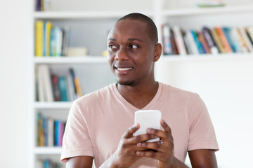 African american bald headed mature man sending message