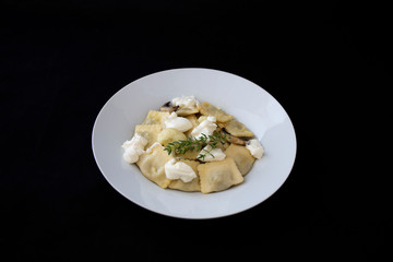 Mushroom ravioli with garlic, walnuts, ricotta and thyme