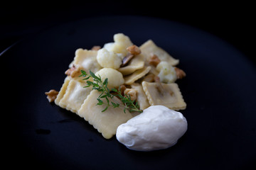 Mushroom ravioli with garlic, walnuts, ricotta and thyme