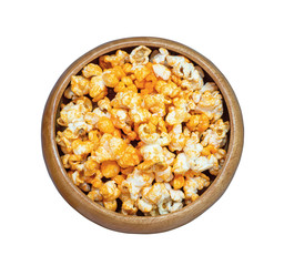 popcorn taste hot spicy in wooden bowl isolated on white background.Top view.