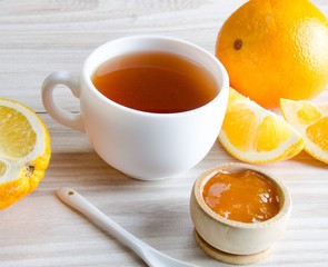 Cup of tea served with orange jam