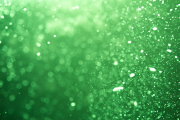 Abstract Green bokeh defocus glitter blur Background.