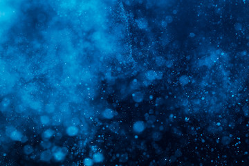 Abstract Blue bokeh defocus glitter blur background.