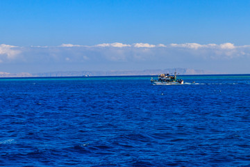 Fishing trawler sails at Red sea in Hurghada, Egypt