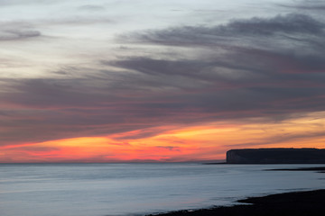 Beautiful vibrant Summer landscape sunset image of Seven Sisters chalk cliffs in England