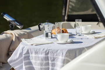Romantic breakfast on motor yacht