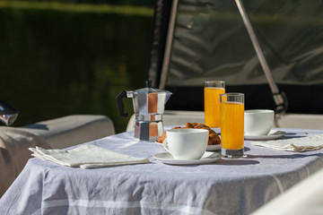Romantic breakfast on motor yacht