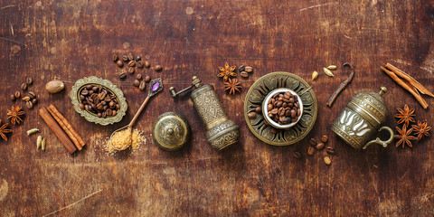Coffee cup with coffee grinder, coffee beans and spices