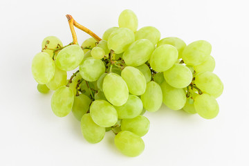 One bunch of ripe organic white grapes isolated on white background, side view