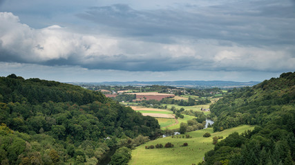 Fototapeta na wymiar Stunning Summer landscape of view from Symonds Yat over River Wye in English and Welsh countryside