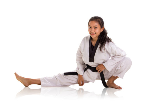 Cheerful female fighter physical training and stretching