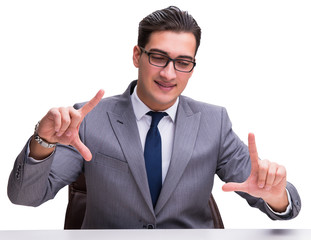 Young businessman pressing virtual buttons isolated on white bac