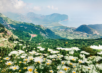Fototapeta na wymiar Attractive morning seascape of Adriatic sea with Petrovac town on background. Amazing summer view of Montenegro countryside. Beautiful world of Mediterranean countries. 