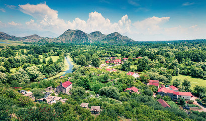Aerial summer view of valley of Moraca river from Zabljak Crnojevica Fortress. Picturesque morning scene of Skadar Lake National Park, Montenegro countryside, Europe. 