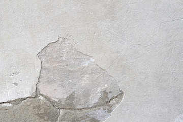 Old damaged multi-colored wall with an abstract pattern. Element for background design.