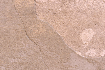 Old damaged multi-colored wall with an abstract pattern. Element for background design.