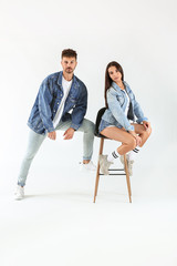 Fashionable young couple on white background