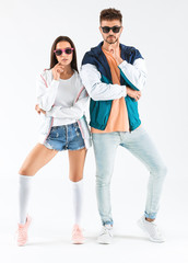 Fototapeta premium Fashionable young couple on white background