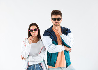 Fashionable young couple on white background