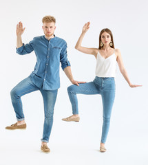 Obraz premium Fashionable young couple in stylish casual clothes on white background