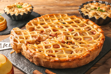 Tasty apple pie on table