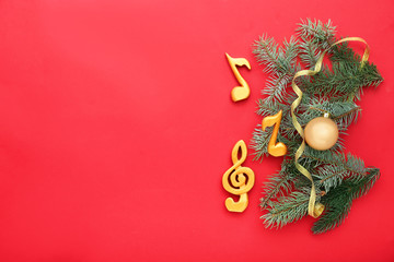 Notes, violin clef and Christmas decor on color background
