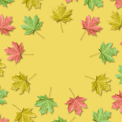 Maple leaves organized in round frame with copy space. Fall background.