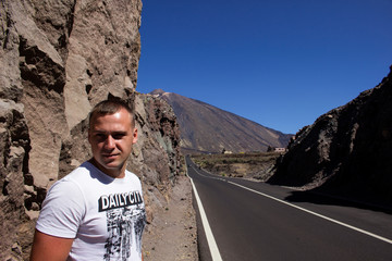 young man on the road by the volcano Teide - 291249971